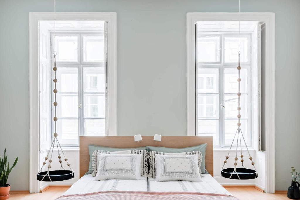 Posteľ alebo postele v izbe v ubytovaní Herbarium Apartment