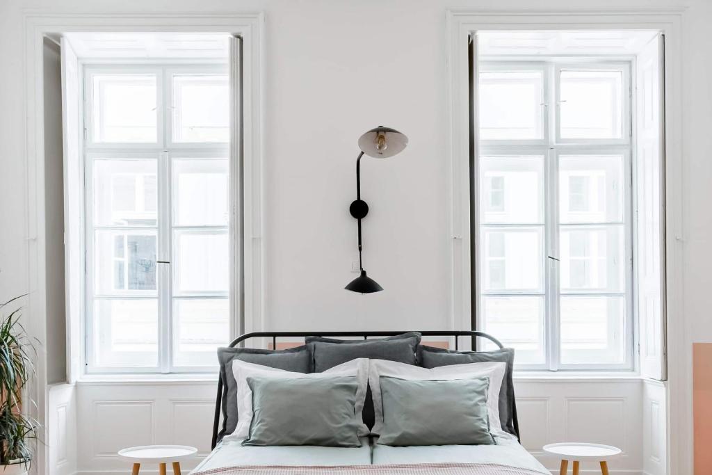 Posteľ alebo postele v izbe v ubytovaní Herbarium Apartment