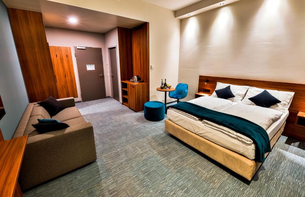 Voodi või voodid majutusasutuse Hotel Das Zeit toas