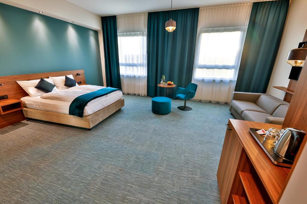 Voodi või voodid majutusasutuse Hotel Das Zeit toas