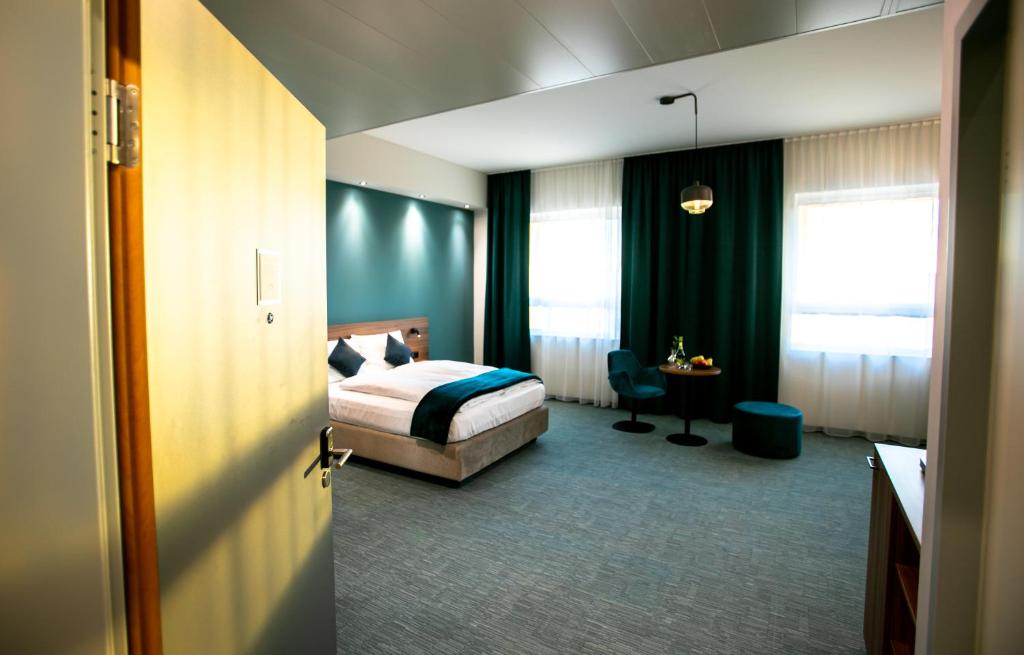 Voodi või voodid majutusasutuse Hotel Das Zeit toas