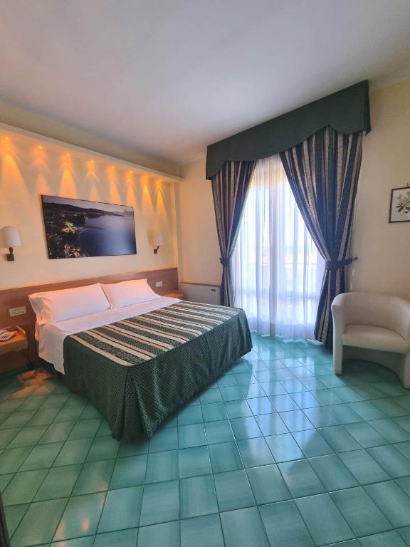 Postel nebo postele na pokoji v ubytování Hotel Girasole