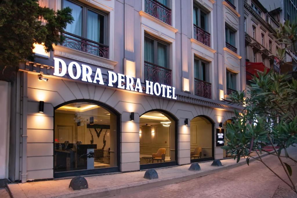 a building with a sign on the front of it at Dora Pera Hotel in Istanbul