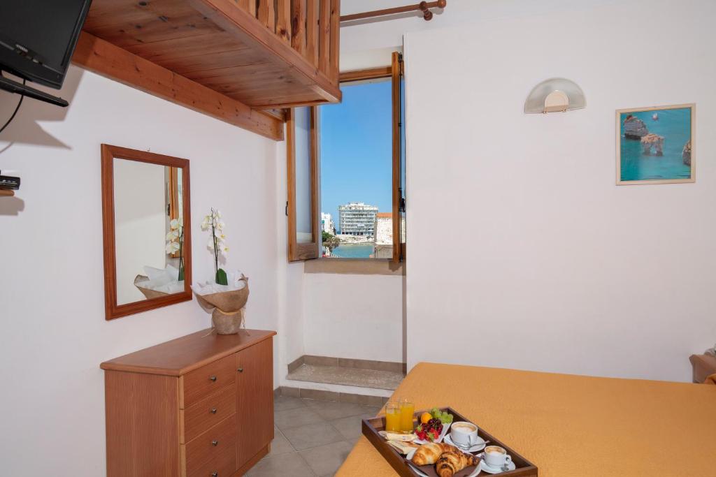 Postel nebo postele na pokoji v ubytování Hotel Punta San Francesco