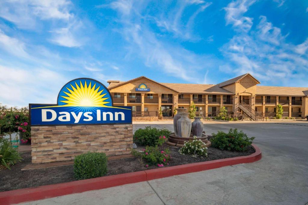 a days inn sign in front of a building at Days Inn by Wyndham Galt in Galt