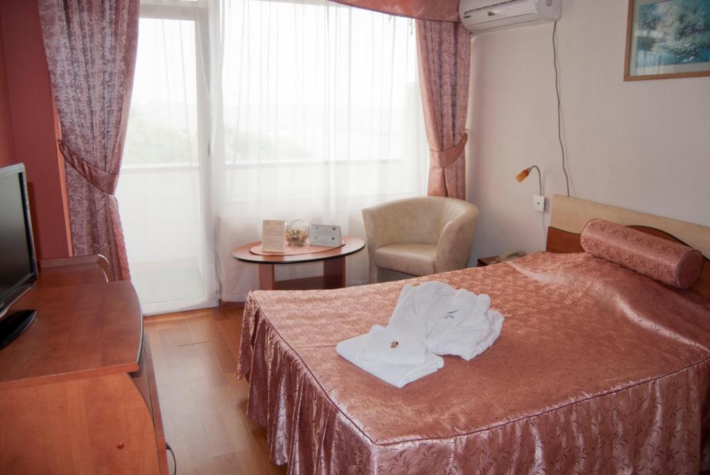 Postel nebo postele na pokoji v ubytování Hotel Paradiso