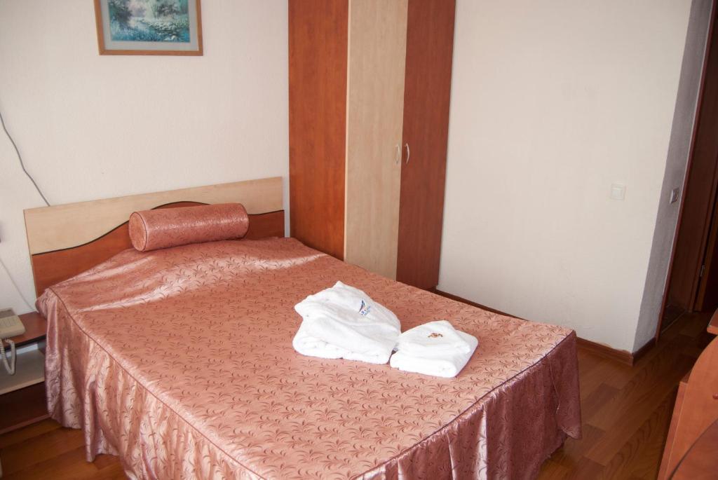 Postel nebo postele na pokoji v ubytování Hotel Paradiso