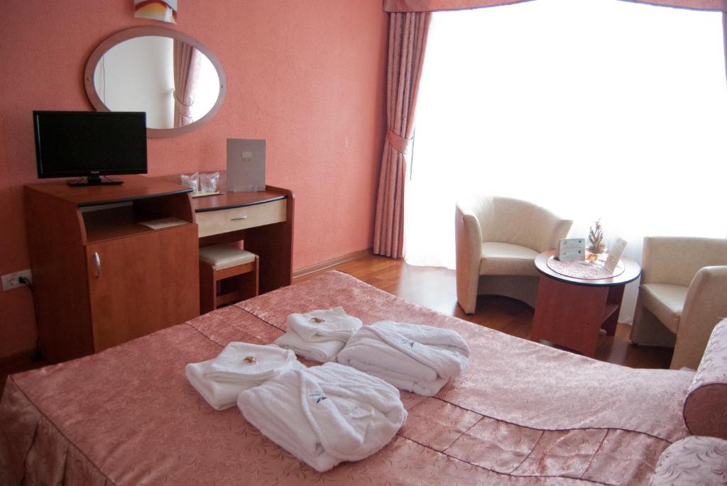 Postel nebo postele na pokoji v ubytování Hotel Paradiso