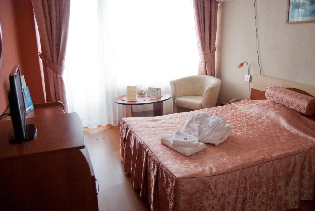 Postel nebo postele na pokoji v ubytování Hotel Paradiso