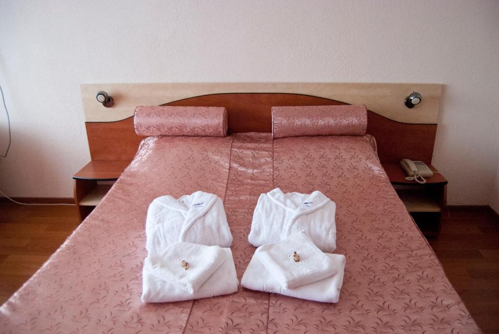 Postel nebo postele na pokoji v ubytování Hotel Paradiso