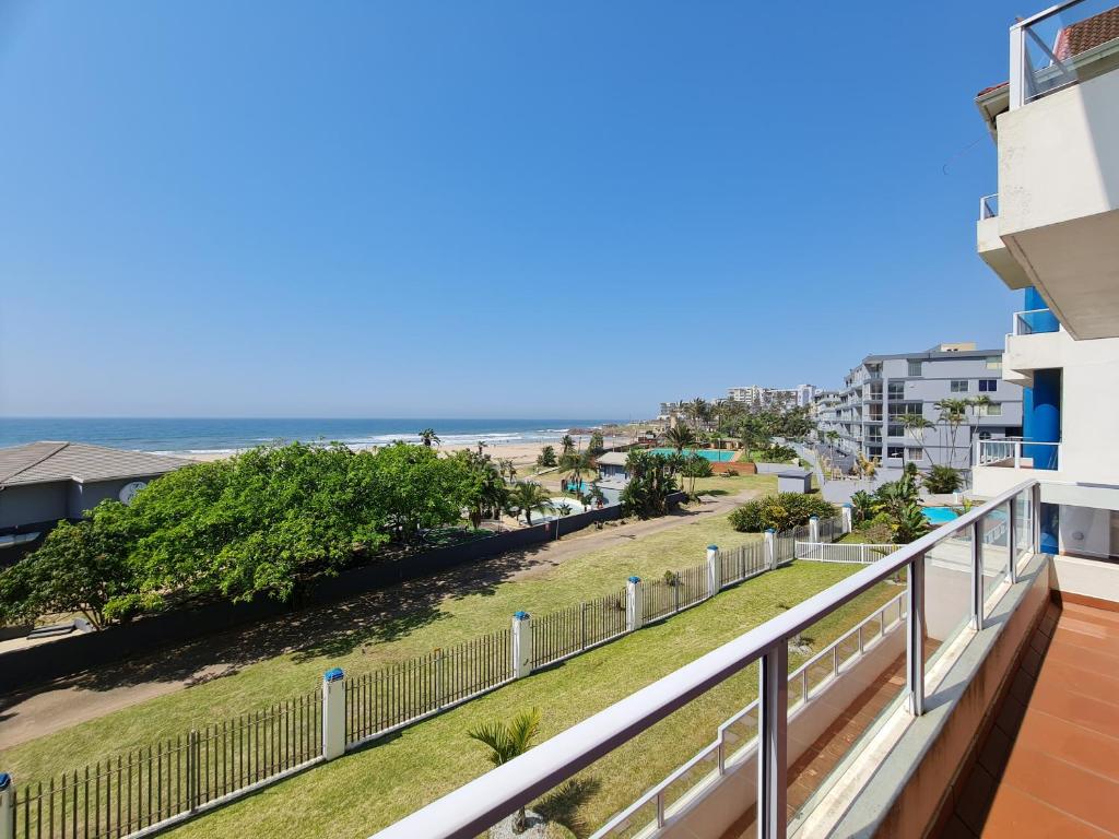 a balcony with a view of the beach at Colonial Sands B in Margate