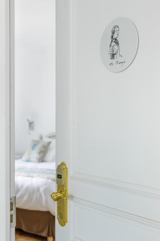Postel nebo postele na pokoji v ubytování L'Hôtel Particulier - Paris Asnières