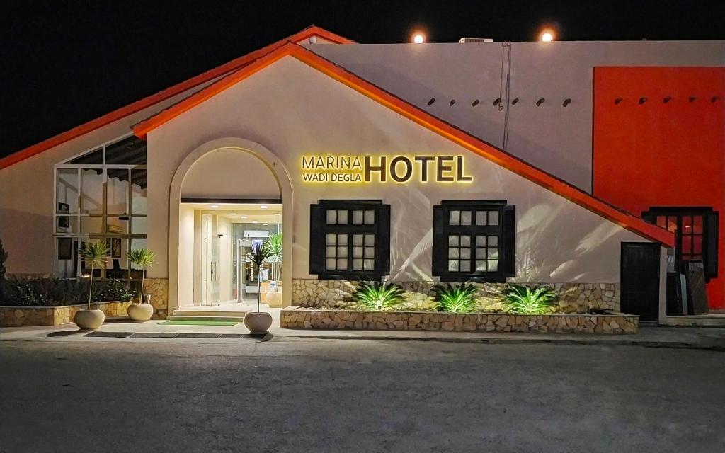 a hotel with a sign on the side of it at Marina Wadi Degla Hotel in Ain Sokhna
