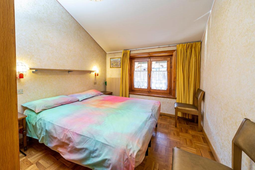 Posteľ alebo postele v izbe v ubytovaní Chalet La Nuvola