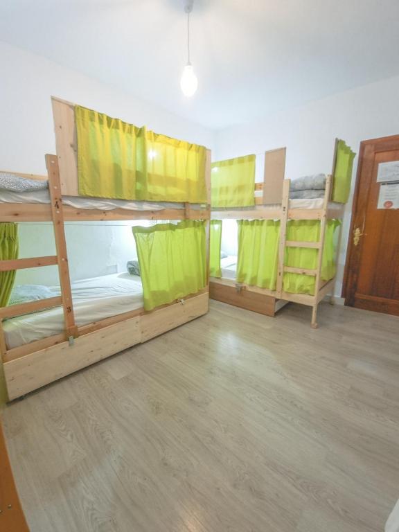Postel nebo postele na pokoji v ubytování Aguere Nest Hostel
