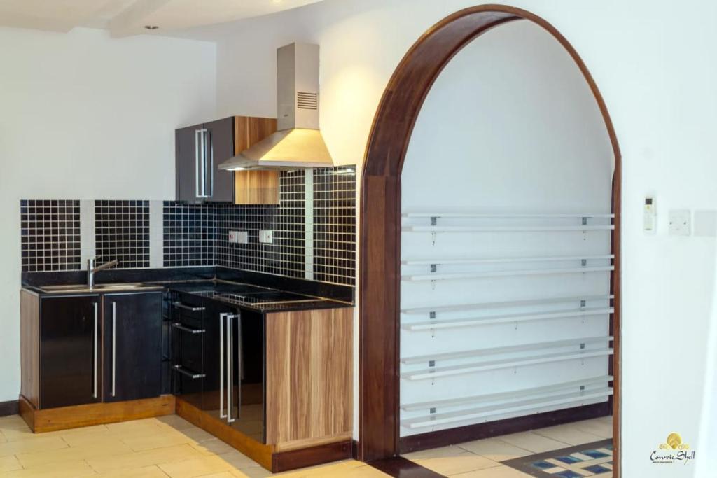 Kuchyň nebo kuchyňský kout v ubytování Rosy Sea Front Beach Condo