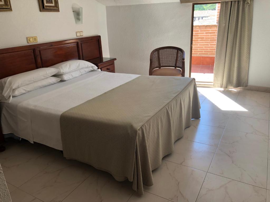 Postel nebo postele na pokoji v ubytování Hotel Martin