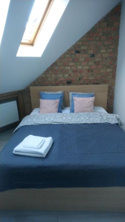 Posteľ alebo postele v izbe v ubytovaní Secret Apartament 2 Poznań