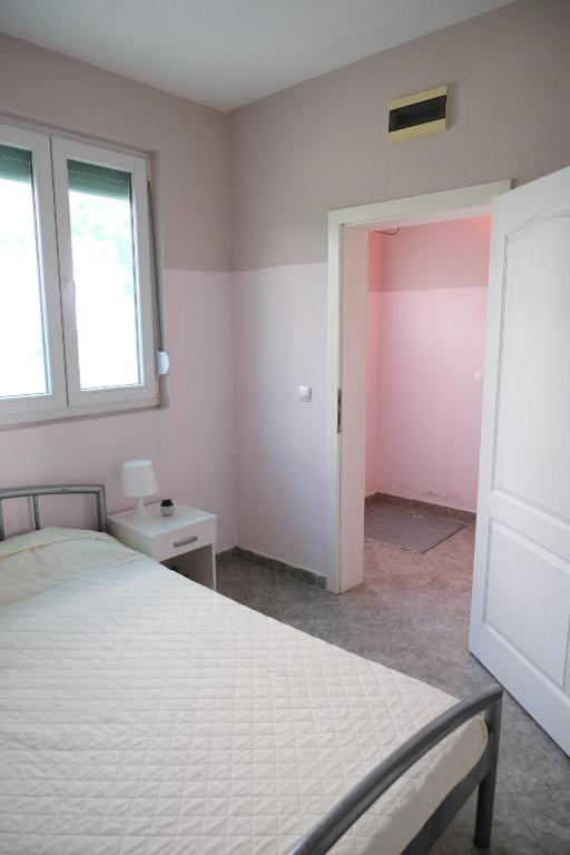 Postel nebo postele na pokoji v ubytování Apartments Jasmina