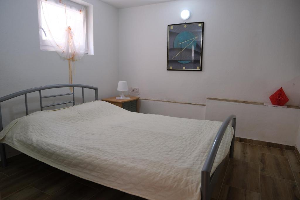 Postel nebo postele na pokoji v ubytování Apartments Jasmina