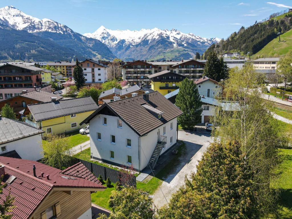an aerial view of a town with snow covered mountains at Chalet Love The Alps by All in One Apartments in Zell am See