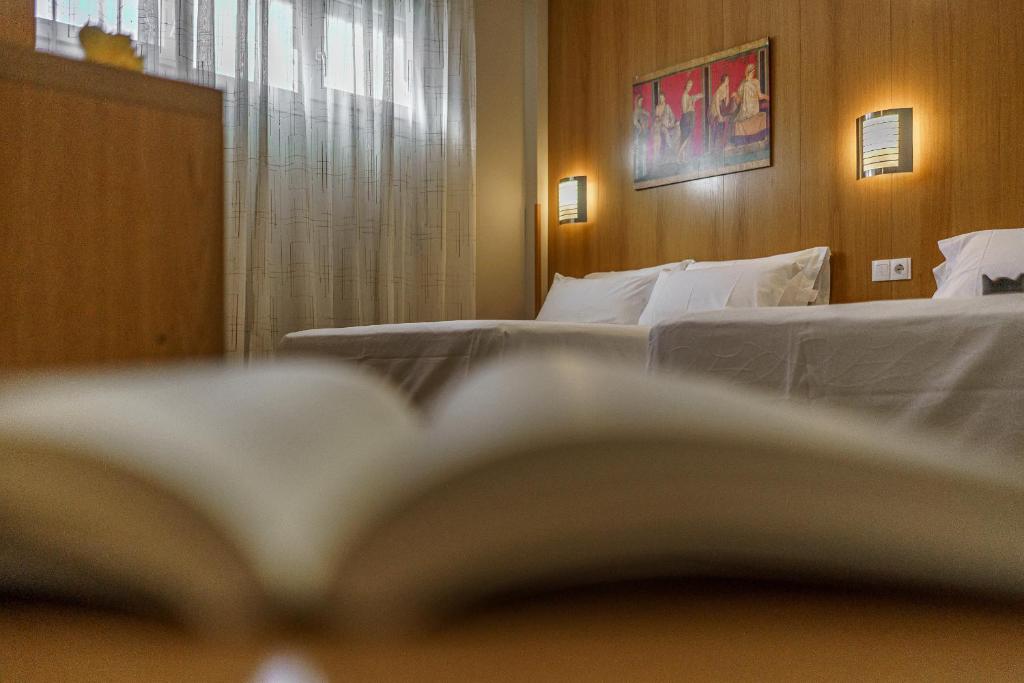 Postel nebo postele na pokoji v ubytování Hostal Acueducto Los Milagros