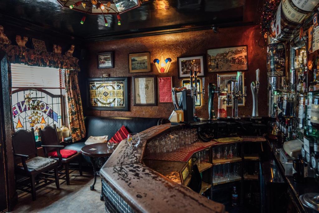 een bar met een bar in een pub bij Charlemont House Exclusive Hire Perfect for Groups of 8 to 23 persons in Moy