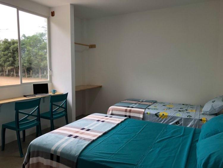 Postel nebo postele na pokoji v ubytování EL JARDIN OLON SUITES