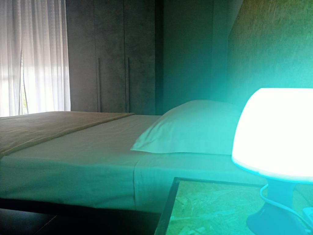 Postel nebo postele na pokoji v ubytování LE MURA Foresteria