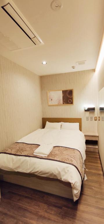 Postel nebo postele na pokoji v ubytování Hotel Charire Kichijoji