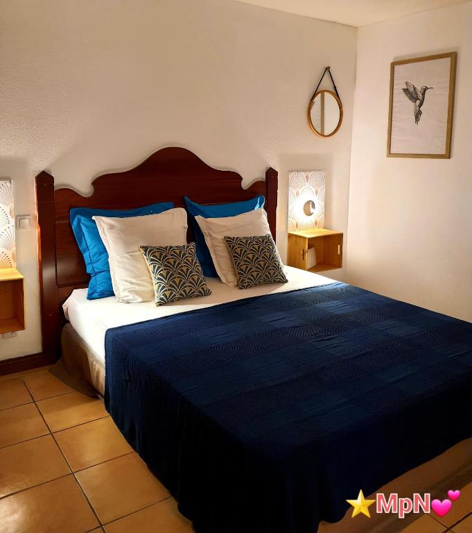 Postel nebo postele na pokoji v ubytování Mon Pti Nid - Havre cosy avec vue tropicale en Martinique