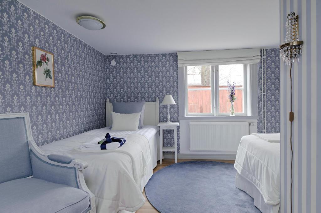 Postel nebo postele na pokoji v ubytování Hilma Winblads Bed & Breakfast