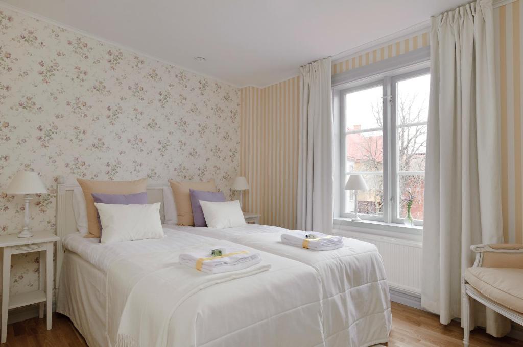 Postel nebo postele na pokoji v ubytování Hilma Winblads Bed & Breakfast
