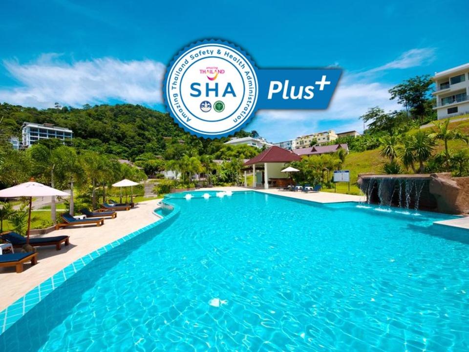 
a swimming pool with a pool table and chairs at PS Hill Resort - SHA Plus in Patong Beach
