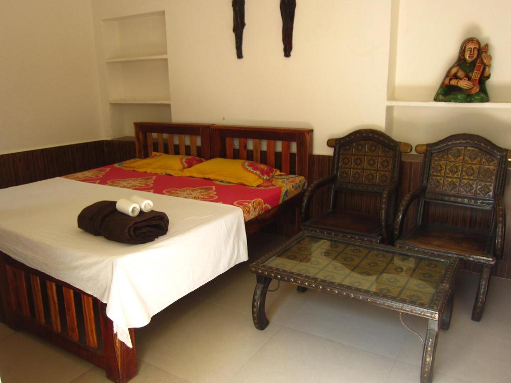 Postel nebo postele na pokoji v ubytování Atithi Guest House Pushkar