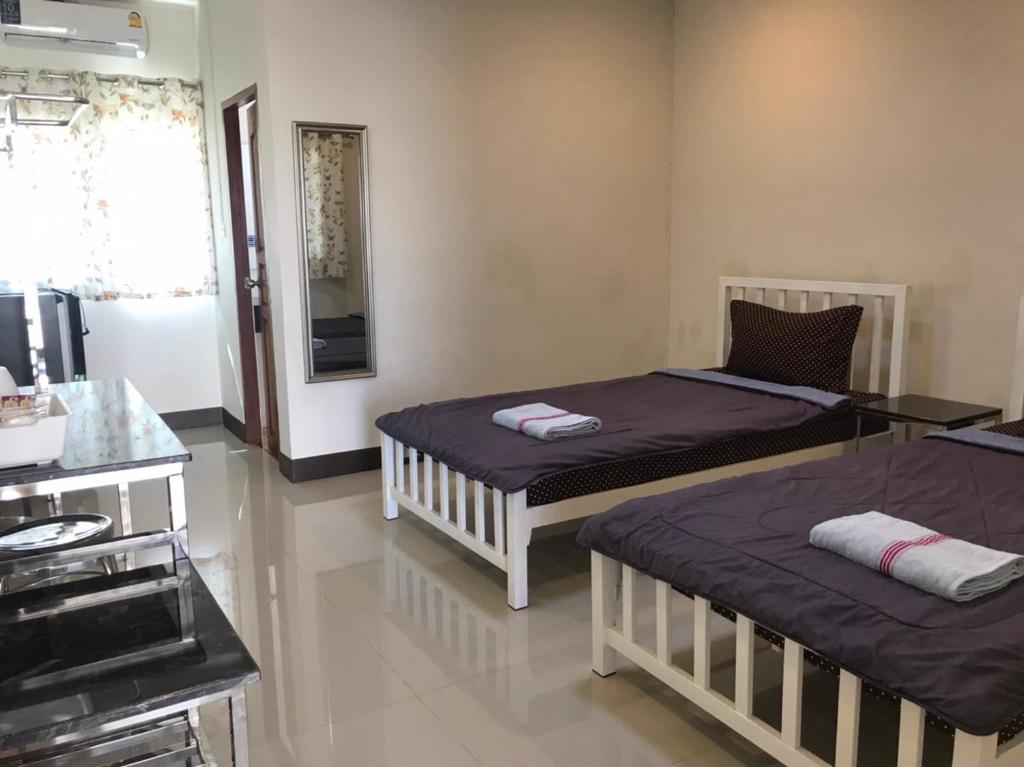 Postel nebo postele na pokoji v ubytování DD Residence Sai5 Salaya ห้องพัก ดีดี สาย5 ศาลายา
