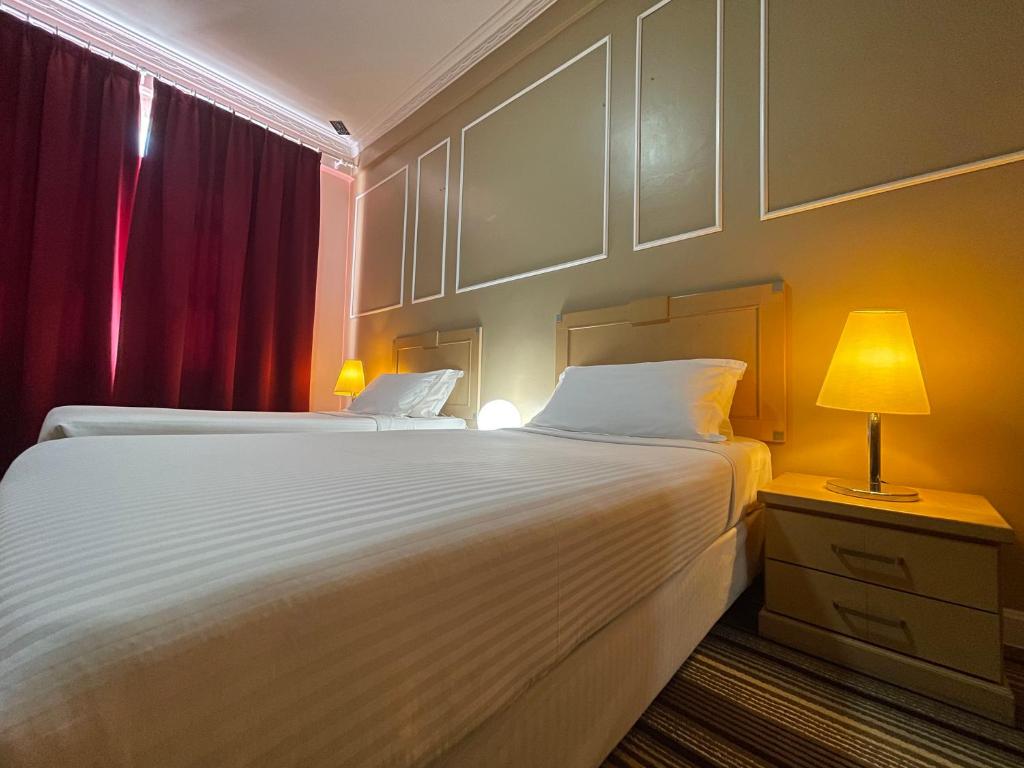 Uma cama ou camas num quarto em Hotel UiTM Shah Alam