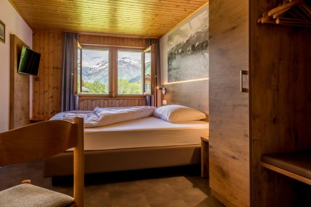 Postel nebo postele na pokoji v ubytování Hotel Walser