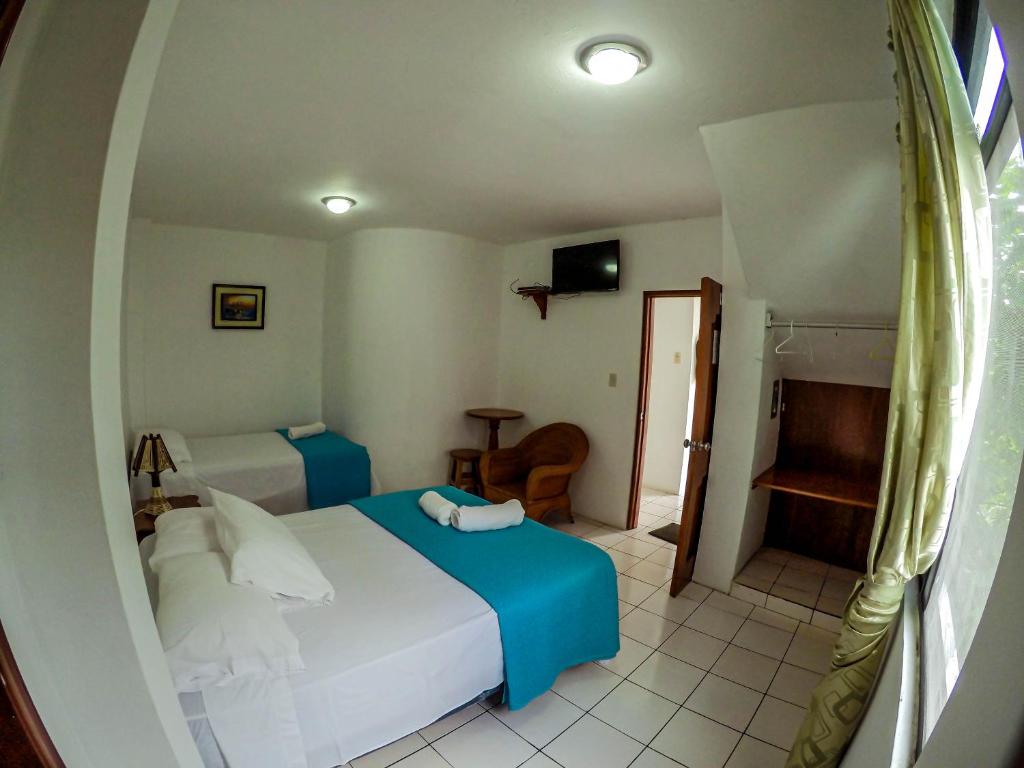 Postel nebo postele na pokoji v ubytování Casa de Nelly