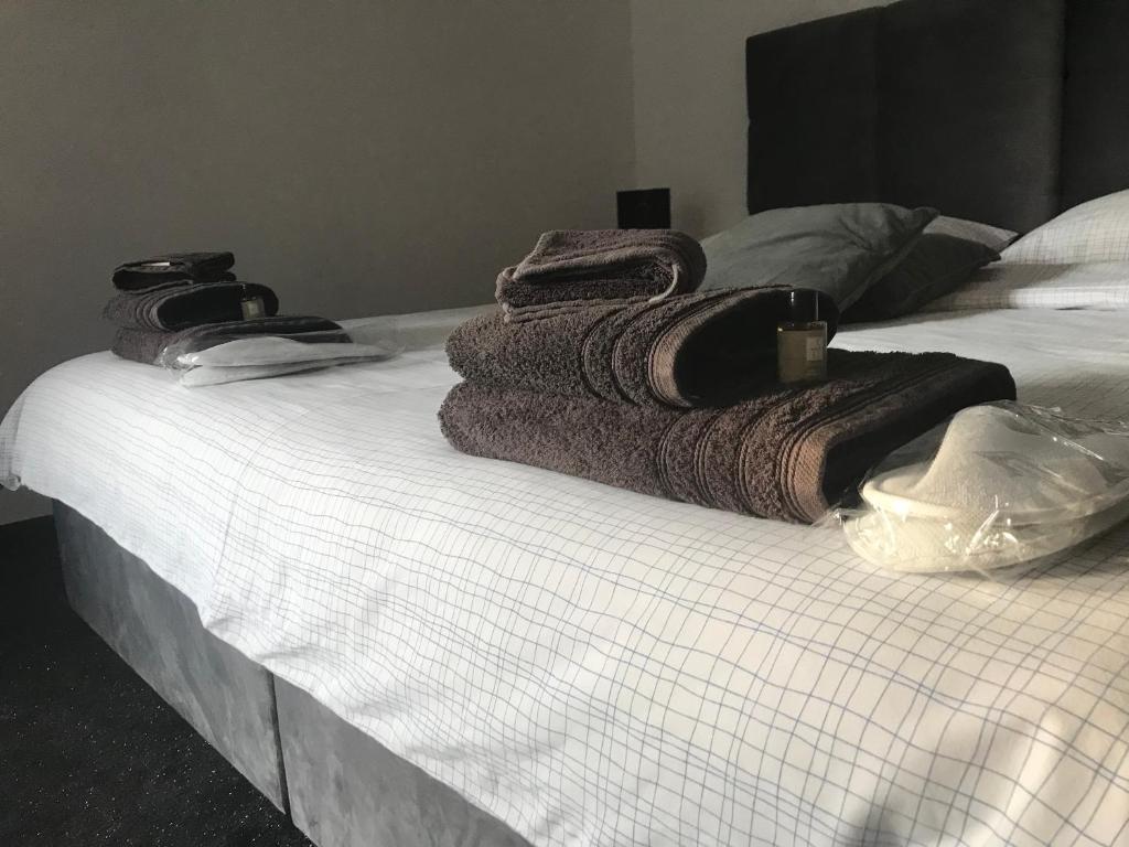 Postel nebo postele na pokoji v ubytování WooW Apartments