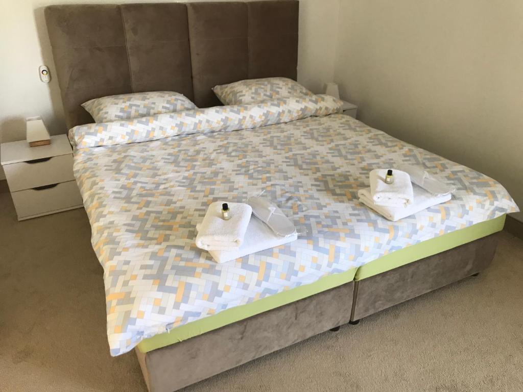 Postel nebo postele na pokoji v ubytování WooW Apartments