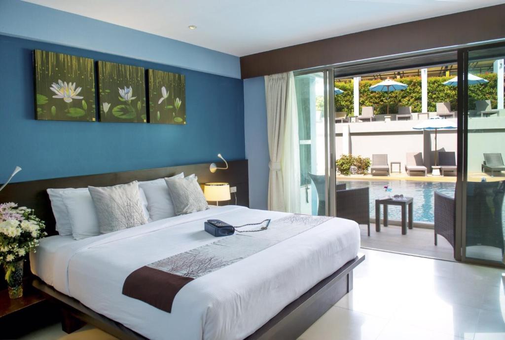 Postel nebo postele na pokoji v ubytování Blue Tara Hotel Krabi Ao Nang