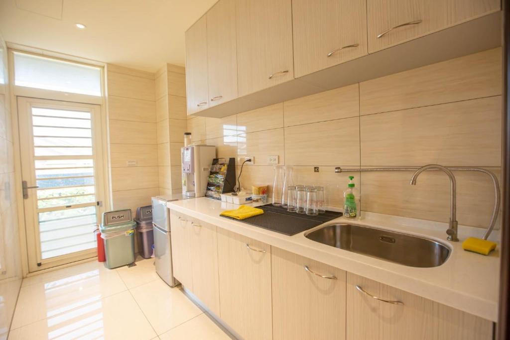 Kuchyň nebo kuchyňský kout v ubytování 雅舍 Arthur Hostel
