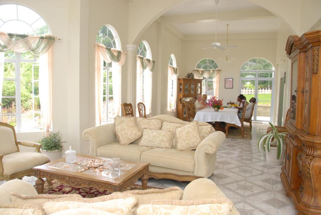 a living room with a couch and a table at Zamaca' Bed and Breakfast in Micoud