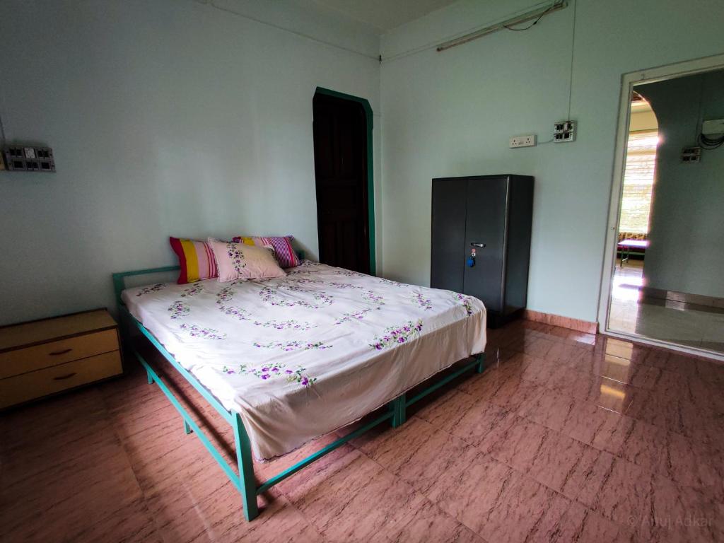 Cama o camas de una habitación en Sakhey Homestay