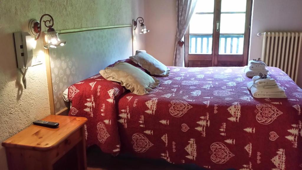 Postel nebo postele na pokoji v ubytování Hotel Locanda Belvedere