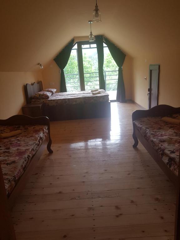 Llit o llits en una habitació de Guest House Sando