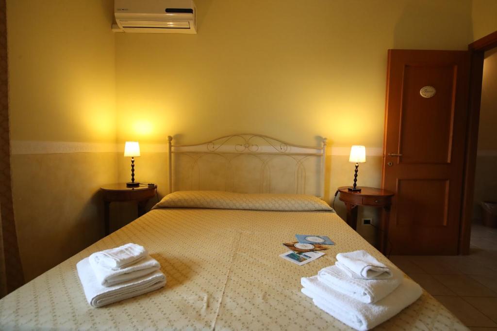 Postel nebo postele na pokoji v ubytování Le Terrazze B&B
