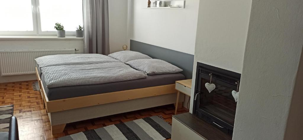Postel nebo postele na pokoji v ubytování Ubytování U Zastávky