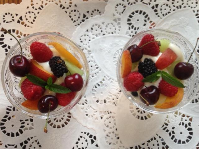 two glass bowls filled with fruit on a table at Casa Blanca Boutique Bed & Breakfast in Niagara-on-the-Lake